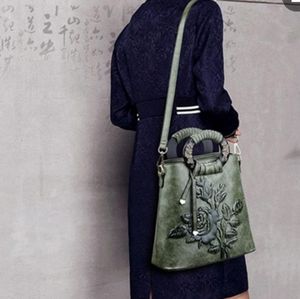 Women's tooled vintage crossbody bag